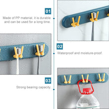 Wall-mounted bathroom shelf with hooks, ideal for organizing toothbrushes.